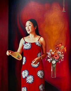 An oil painting by Josonia Palaitis depicting Dr Cindy Pan wearing a red and white sleeveless dress holding a chinese fan standing next to a vase of mixed colourful flowers looking away from the viewer with an expression of happiness and hope with a rich red and orange background
