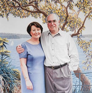 Oil painting by Josonia Palaitis depicting Prime Minister John Howard with his arm around his wife Janette Howard with Sydney Harbour and a gum tree as a backdrop from the location of Kirribilli House