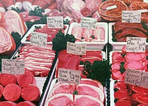 Oil painting by Josonia Palaitis depicting a close up display of meat cuts at a butcher's shop with price labels attached to skewers