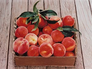 Photorealistic painting by Josonia Palaitis depicting a box filled with peaches placed on a wooden floor