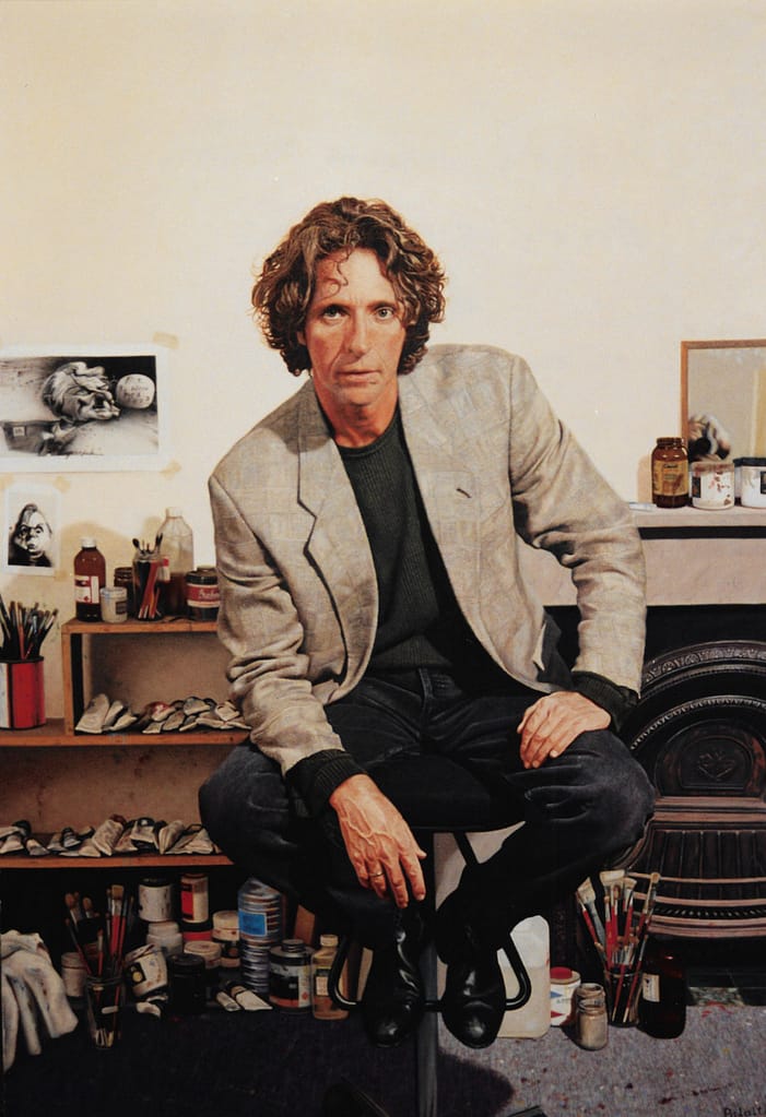 Portrait painting by Josonia Palaitis depicting cartoonist Bill Leak sitting on a stool in his studio with brushes and paints in the background